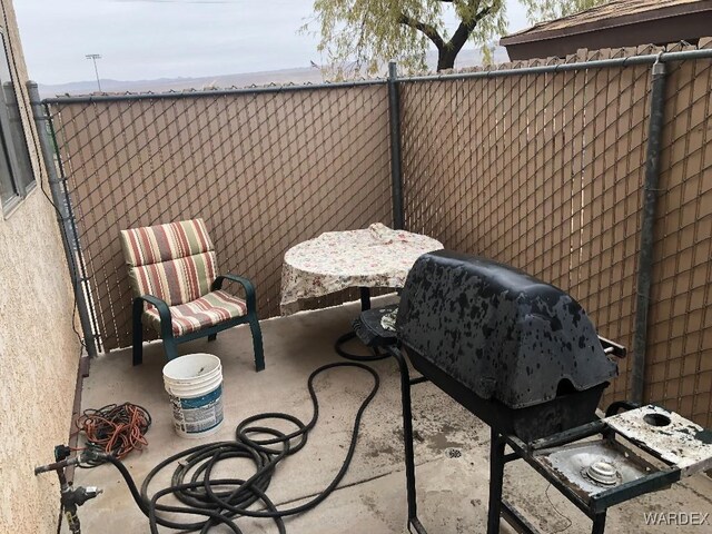 view of patio / terrace featuring fence