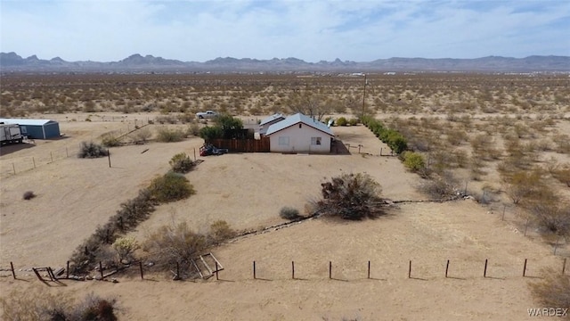 mountain view featuring view of desert and a rural view