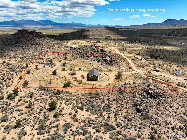 birds eye view of property with a rural view, a mountain view, and a desert view