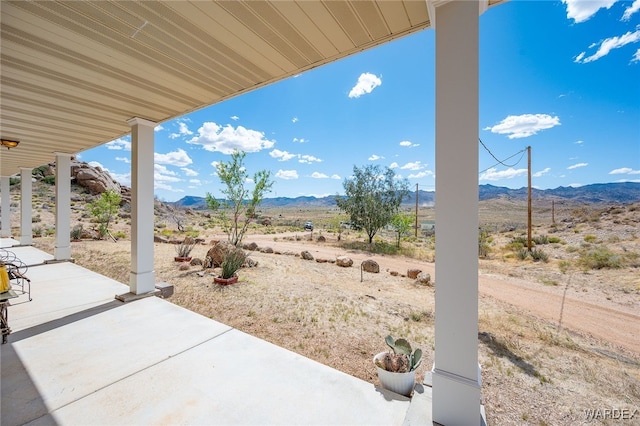 view of patio / terrace with a mountain view