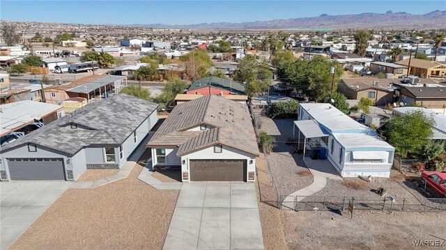 bird's eye view featuring a residential view and a mountain view