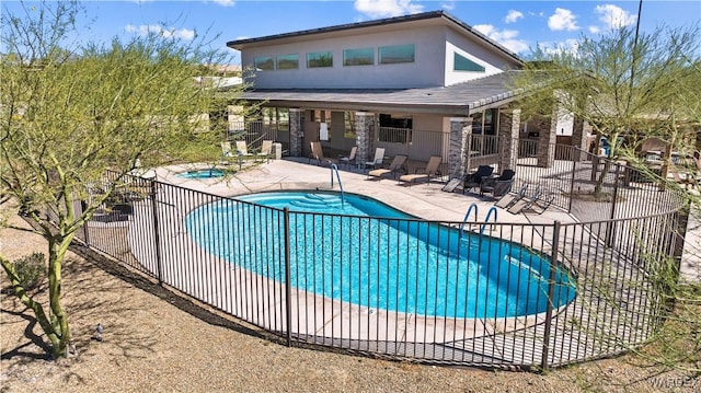 pool featuring a patio area and fence