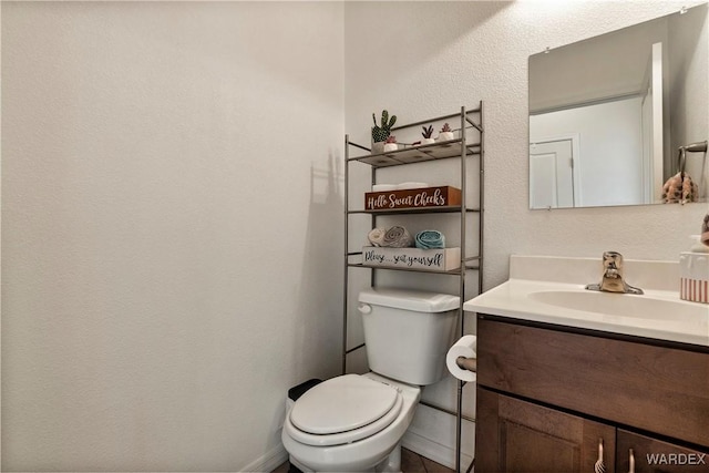 half bath with toilet and vanity