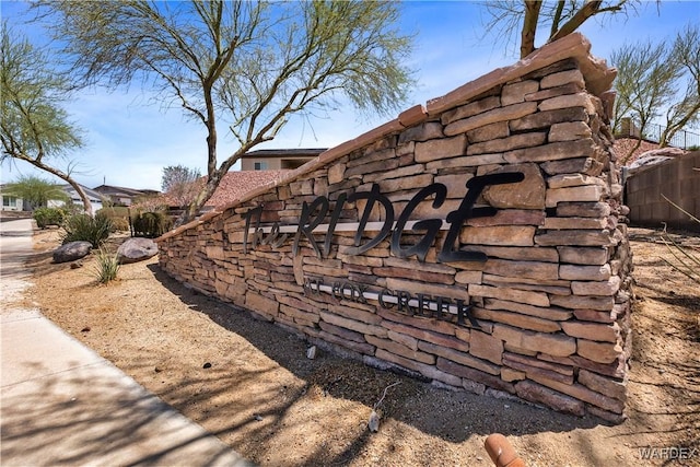 community sign with fence