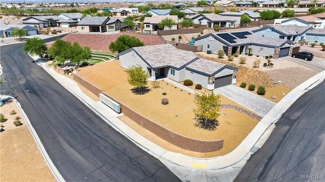 birds eye view of property with a residential view