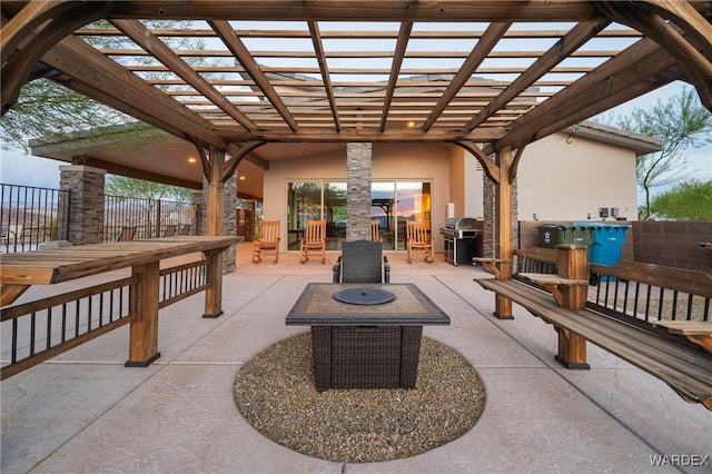 view of patio with fence, a fire pit, area for grilling, and a pergola