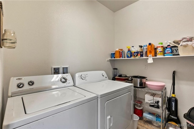 laundry room with laundry area and washing machine and clothes dryer