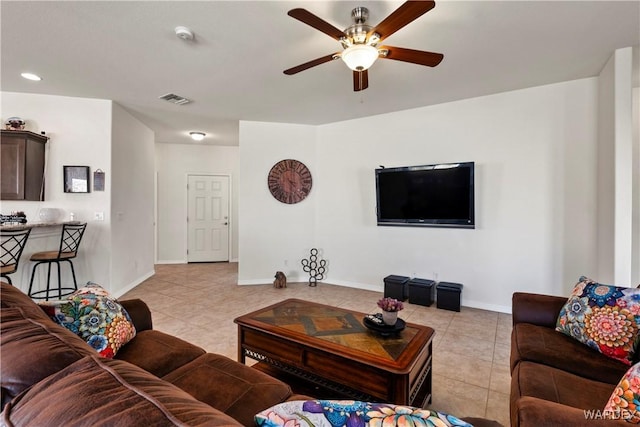 living room with light tile patterned floors, recessed lighting, a ceiling fan, visible vents, and baseboards