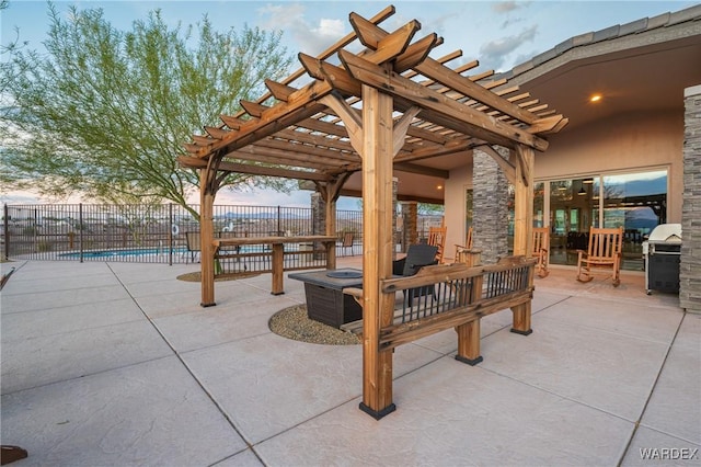 patio terrace at dusk with fence and a pergola