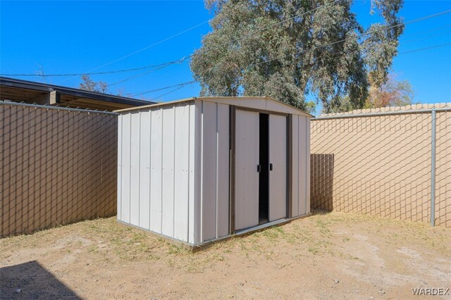 view of shed featuring a fenced backyard