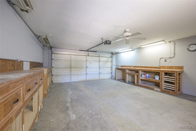 garage featuring a ceiling fan and a garage door opener