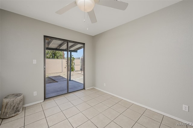 unfurnished room featuring light tile patterned floors, baseboards, and a ceiling fan