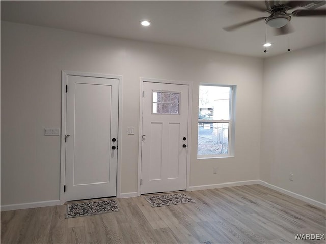 entryway featuring recessed lighting, light wood-type flooring, and baseboards