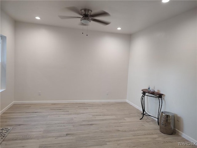 empty room with light wood finished floors, baseboards, a ceiling fan, and recessed lighting