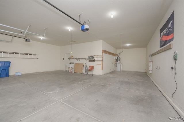 garage with a sink and a garage door opener