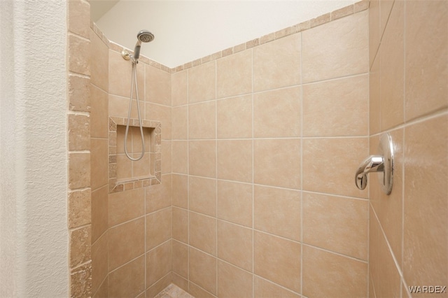 full bath with tiled shower