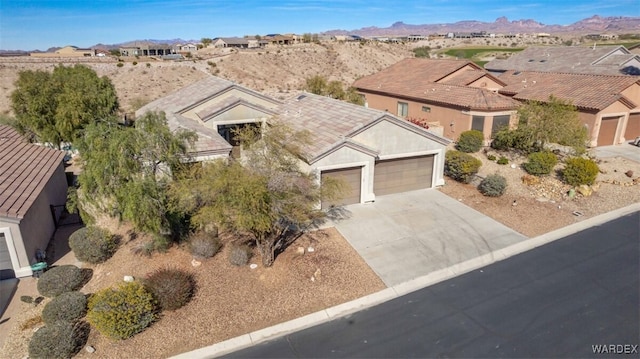 birds eye view of property with a residential view and a mountain view