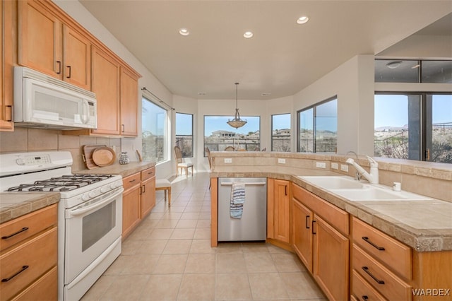 kitchen with pendant lighting, light tile patterned floors, backsplash, a sink, and white appliances