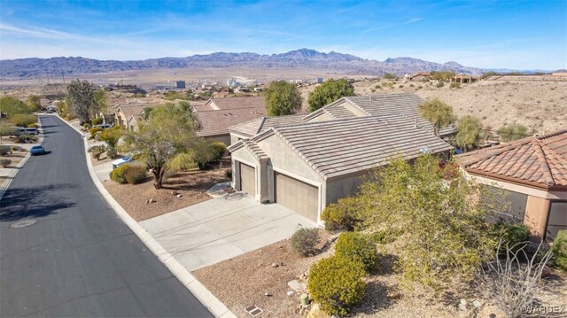 birds eye view of property featuring a mountain view