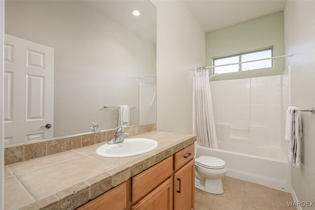 bathroom featuring toilet, tile patterned flooring, shower / bath combination with curtain, and vanity