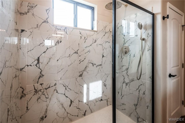 full bath featuring a marble finish shower