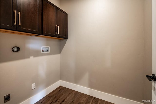 laundry room featuring hookup for an electric dryer, dark wood-style flooring, washer hookup, baseboards, and cabinet space