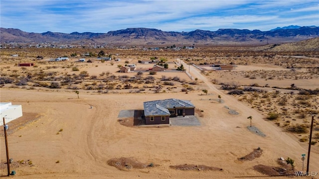 aerial view featuring a mountain view and a desert view