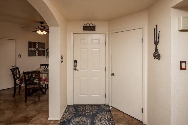 1650 Smoketree Ave Unit 103, Lake Havasu, AZ 86403 - foyer entrance featuring a ceiling fan, arched walkways, and tile patterned floors