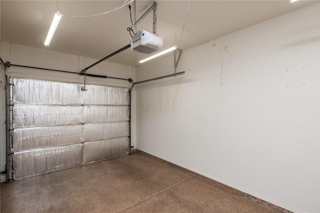 1650 Smoketree Ave Unit 103, Lake Havasu, AZ 86403 - garage featuring a garage door opener and baseboards