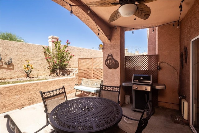 1650 Smoketree Ave Unit 103, Lake Havasu, AZ 86403 - fenced backyard with a patio, ceiling fan, grilling area, and outdoor dining space