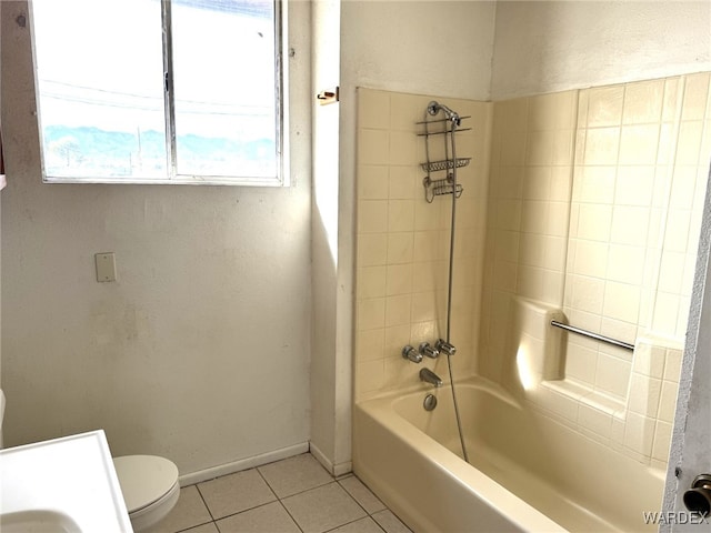 bathroom featuring shower / bathtub combination, baseboards, toilet, and tile patterned floors