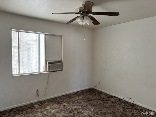 carpeted empty room featuring cooling unit, a ceiling fan, and baseboards