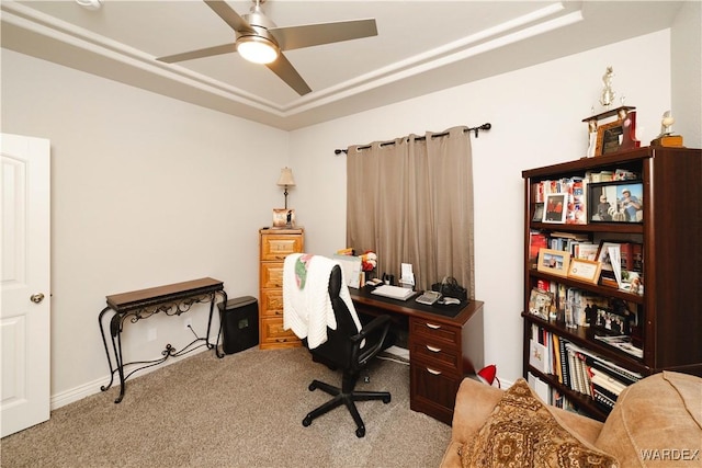 office space featuring a ceiling fan and light carpet