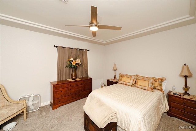 bedroom featuring a ceiling fan and light colored carpet