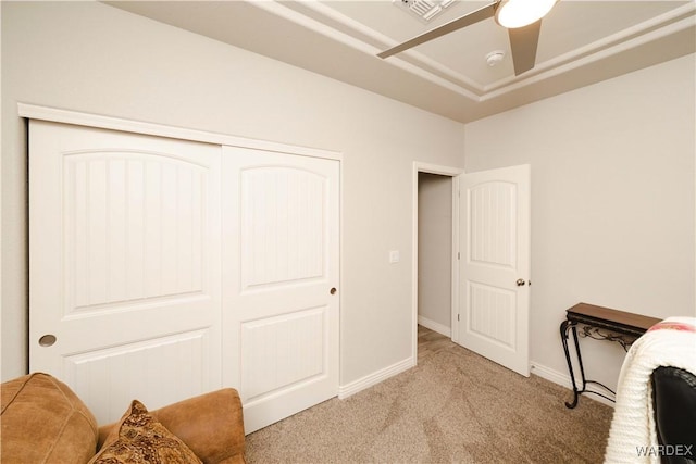 office featuring light carpet, visible vents, and baseboards