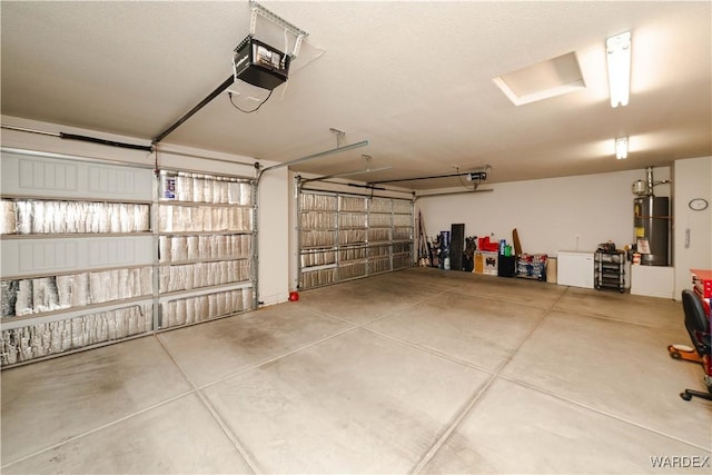 garage featuring gas water heater and a garage door opener