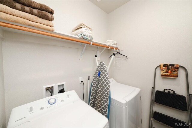 laundry area featuring laundry area and washer and dryer