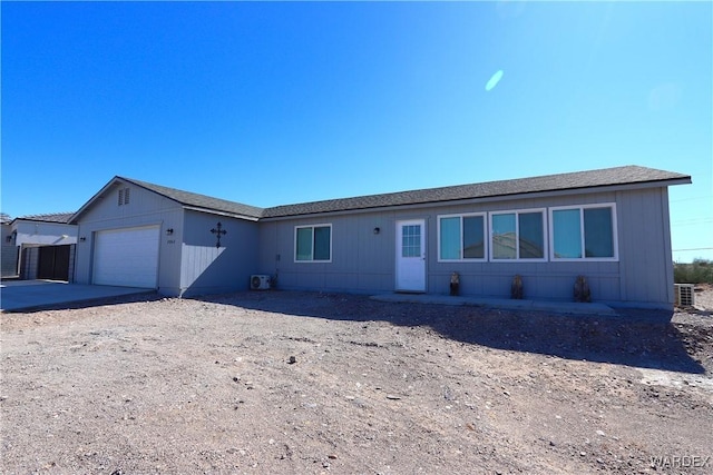 single story home featuring a garage and concrete driveway