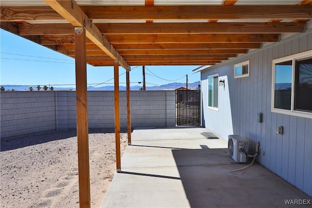 view of patio / terrace featuring ac unit, a gate, and a fenced backyard