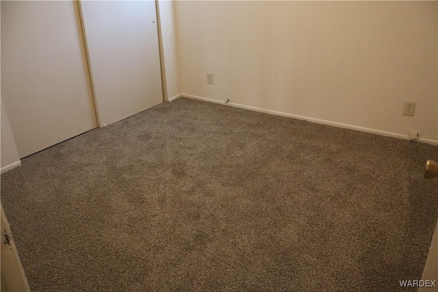 unfurnished bedroom with carpet flooring