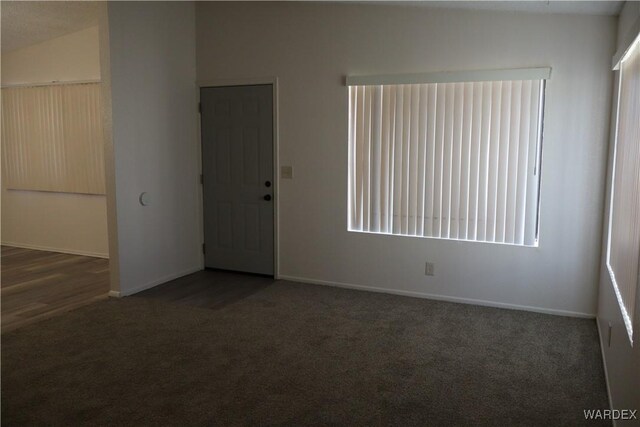 4284 S La Calzada Dr, Fort Mohave, AZ 86426 - empty room with dark colored carpet and baseboards