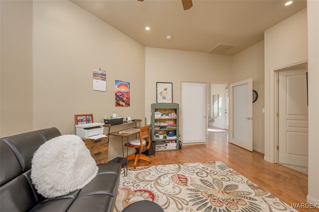 home office with a ceiling fan, light wood-type flooring, visible vents, and recessed lighting