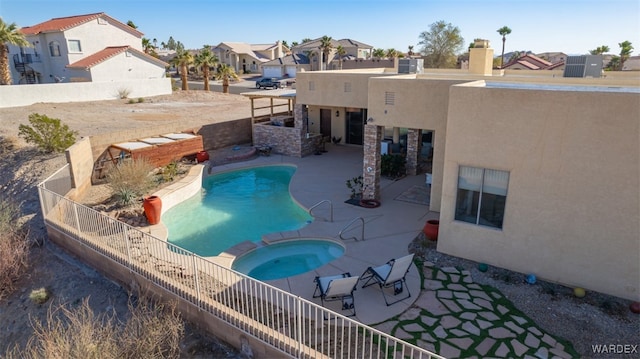 view of pool featuring a fenced backyard, a residential view, and a patio