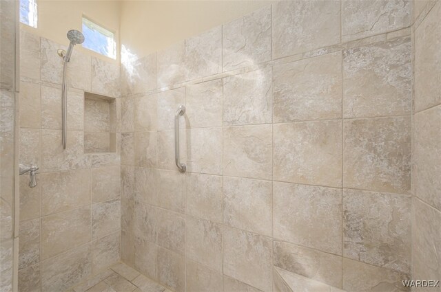 interior space featuring tiled shower