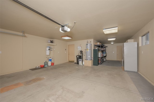 garage with water heater and a garage door opener