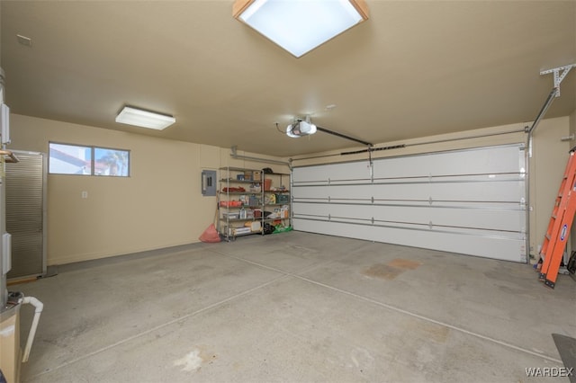 garage featuring a garage door opener and electric panel