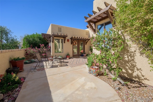 exterior space with a patio, fence, a pergola, and stucco siding