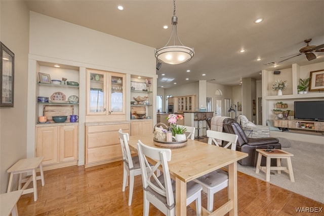 dining space featuring light wood finished floors, ceiling fan, and recessed lighting