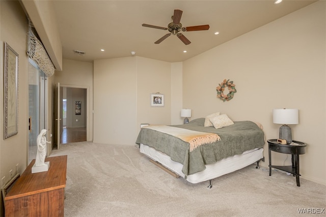 carpeted bedroom featuring ceiling fan, visible vents, and recessed lighting