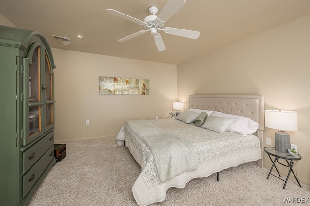 bedroom with light carpet, baseboards, visible vents, and a ceiling fan